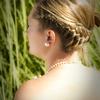 bridal hairstyle updo kept casual with side braid.